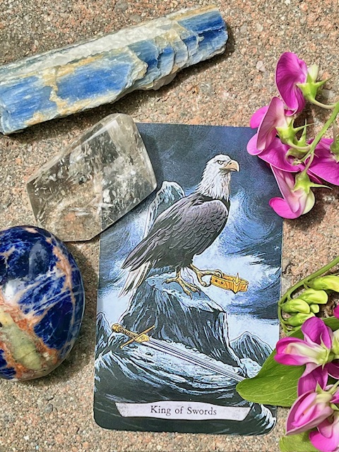 july 2025 energies, sodalite and kyanite crystals, king of swords tarot card